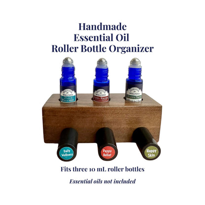 Handmade essential oil roller bottle organizer with three bottles on a white background