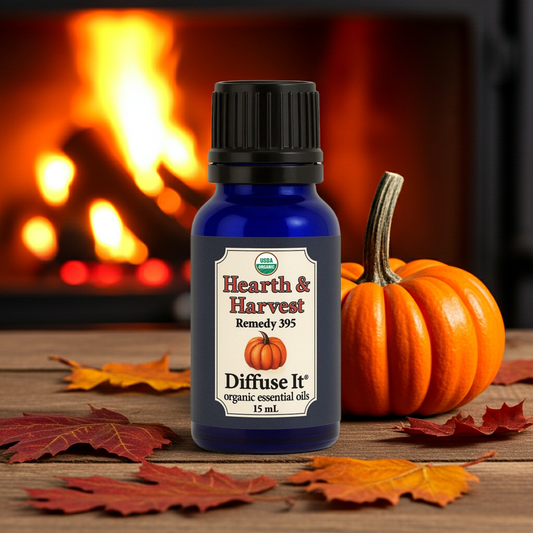 Essential oil bottle labeled 'Hearth & Harvest' with a pumpkin and leaves in front of a fireplace.