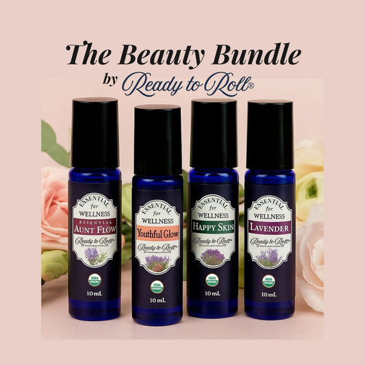 Peach rose background for the Beauty Bundle from Ready to Roll® with four organic blends: Essential Aunt Flow Period Relief and Menopausal Aid, Youthful Glow Anti-Aging Serum, Happy Skin Blemish fighter, and Lavender - all 100% pure, organic.