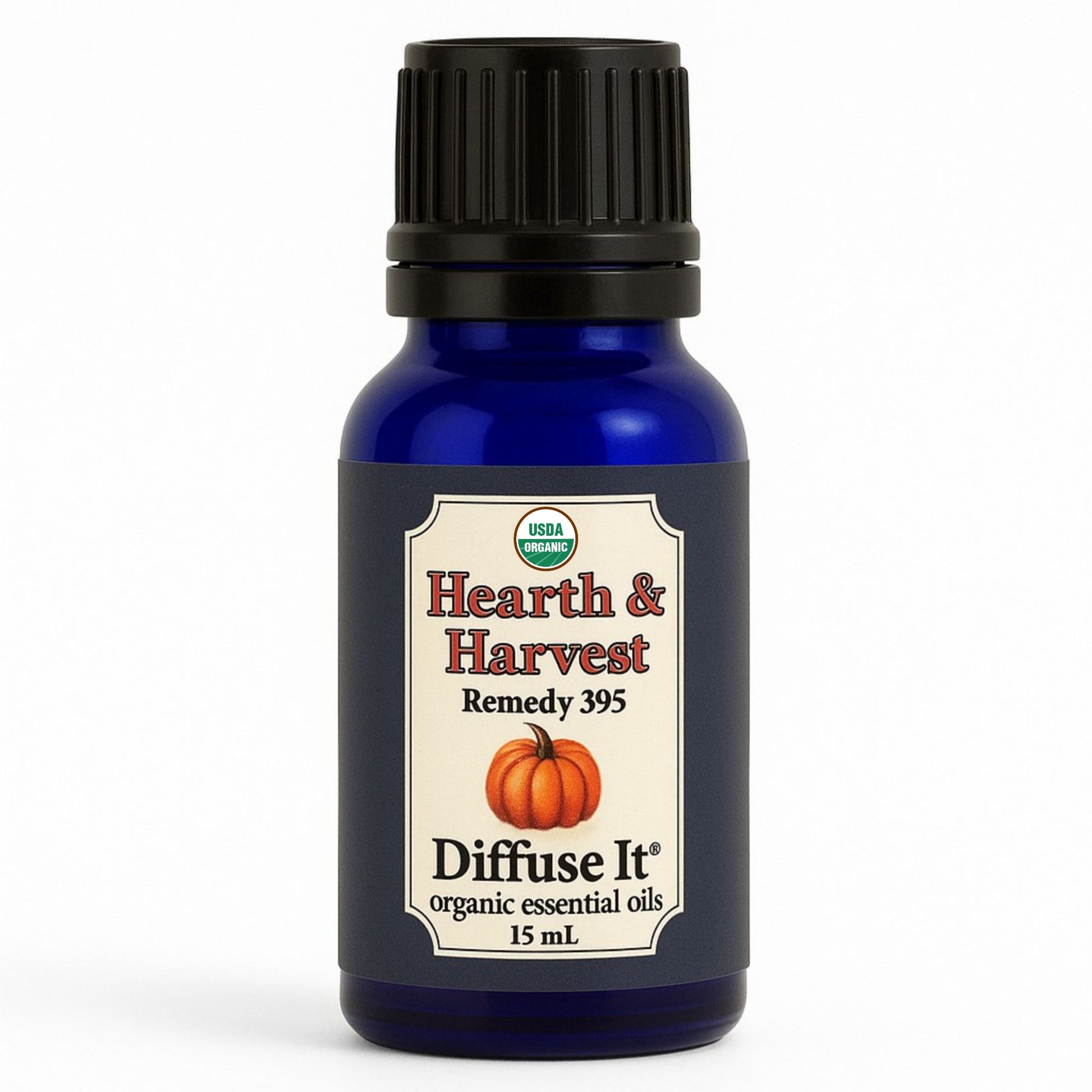Cobalt blue 15 mL bottle of Diffuse It® Organic Hearth & Harvest essential oil blend with organic cinnamon, clove, nutmeg, ginger, sweet orange, and vanilla infusion by Essential for Wellness Organic Essential Oils