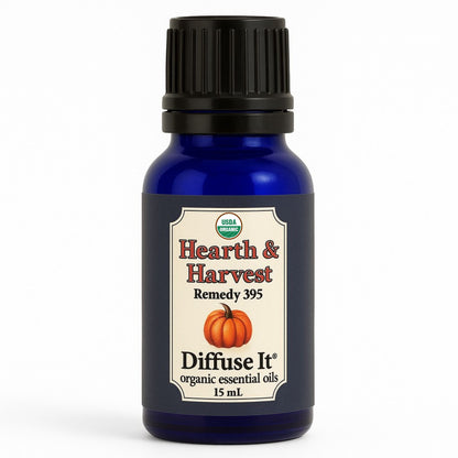 Cobalt blue 15 mL bottle of Diffuse It® Organic Hearth & Harvest essential oil blend with organic cinnamon, clove, nutmeg, ginger, sweet orange, and vanilla infusion by Essential for Wellness Organic Essential Oils
