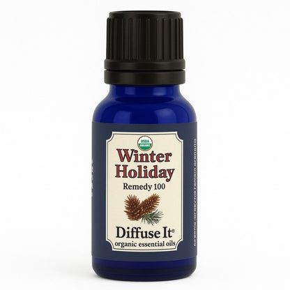 Cobalt blue 15 mL bottle of Diffuse It® Organic Winter Holiday essential oil blend with organic cinnamon, clove, eucalyptus, rosemary, sweet orange, and cedarwood essential oils by Essential for Wellness